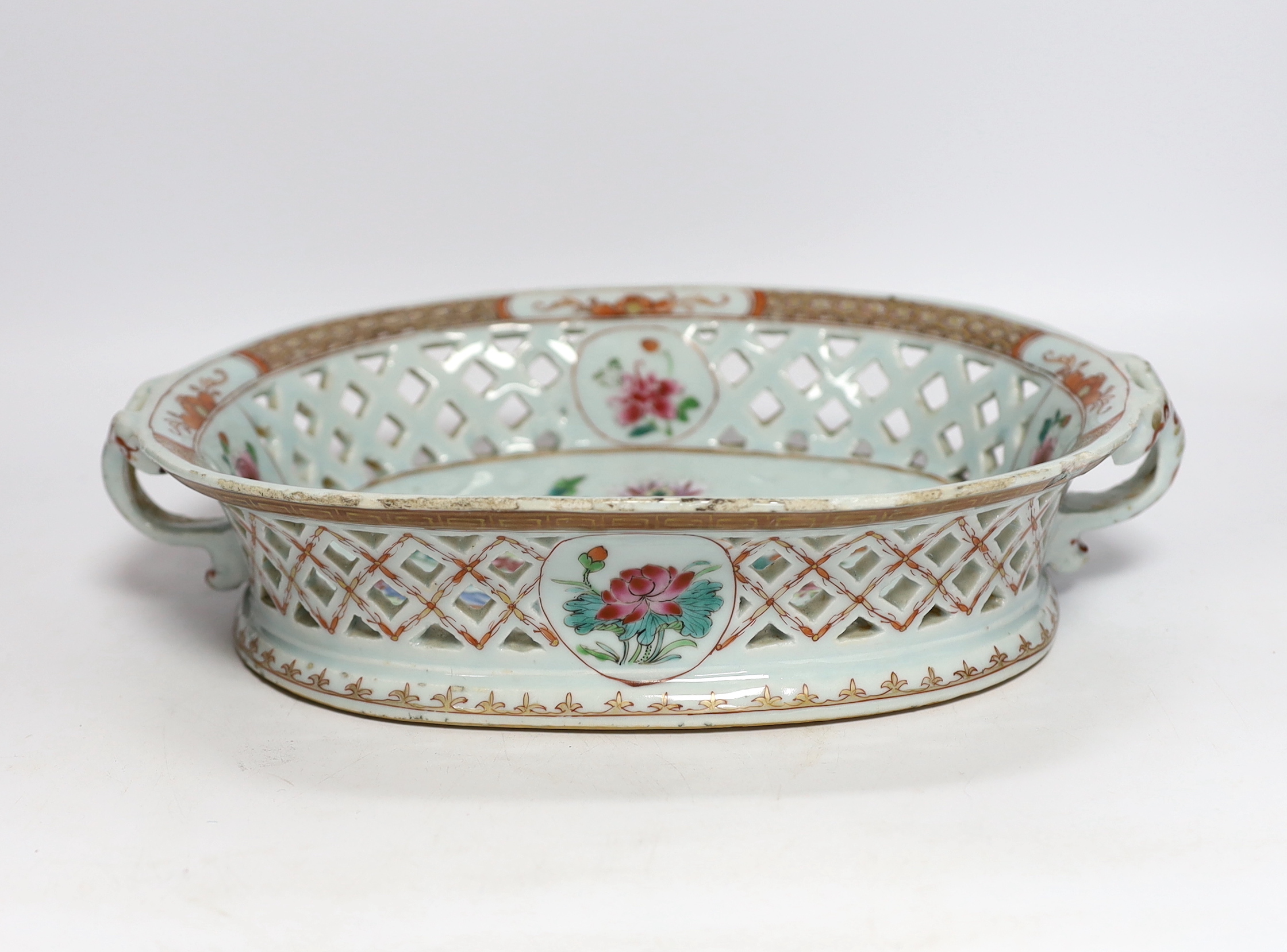 A Chinese famille rose basket with pierced decoration and twin handles, Qianlong period, 31cm wide